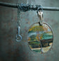 Up with the Morning Dew — An Opalized Petrified Wood Pendant Necklace in Oxidized Silver and 14kt Gold