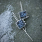 Frozen in Time: Swinging Snowflakes — A Pair of Bridewell Stone Drop Earrings in Sterling Silver