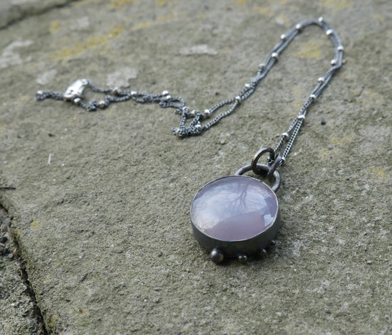 Drifting Snowflake — A Blue Chalcedony Pendant Necklace in Oxidized Sterling Silver