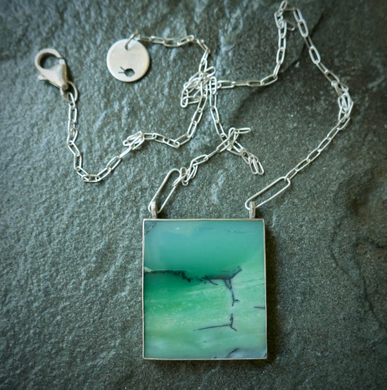 Hidden Scenes — The Meeting; A Petrified Opalized Wood Pendant Necklace in Sterling Silver