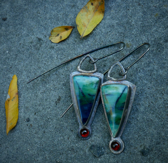 Deep Water Secrets — Blue Opalized Wood and Garnet Dangle Earrings in Oxidized Sterling Silver