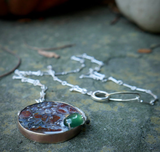 Secret Garden — A Plume Petrified Wood and Serpentine Necklace in Sterling Silver and Brass